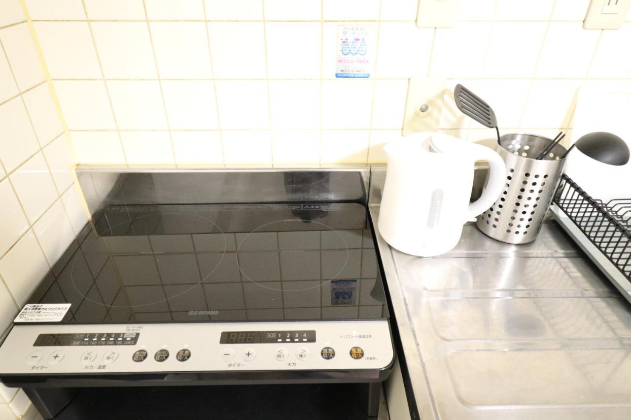 Court Saiwaicho Apartment *