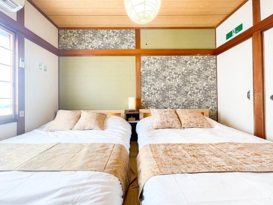 静かな住宅街、商店街横の戸建て　ベッド4台　最大8名様まで Pousada Osaka