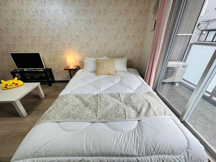 202 黒門市場1分!道頓堀まで徒歩8分!心斎橋まで徒歩9分! Apartment Osaka