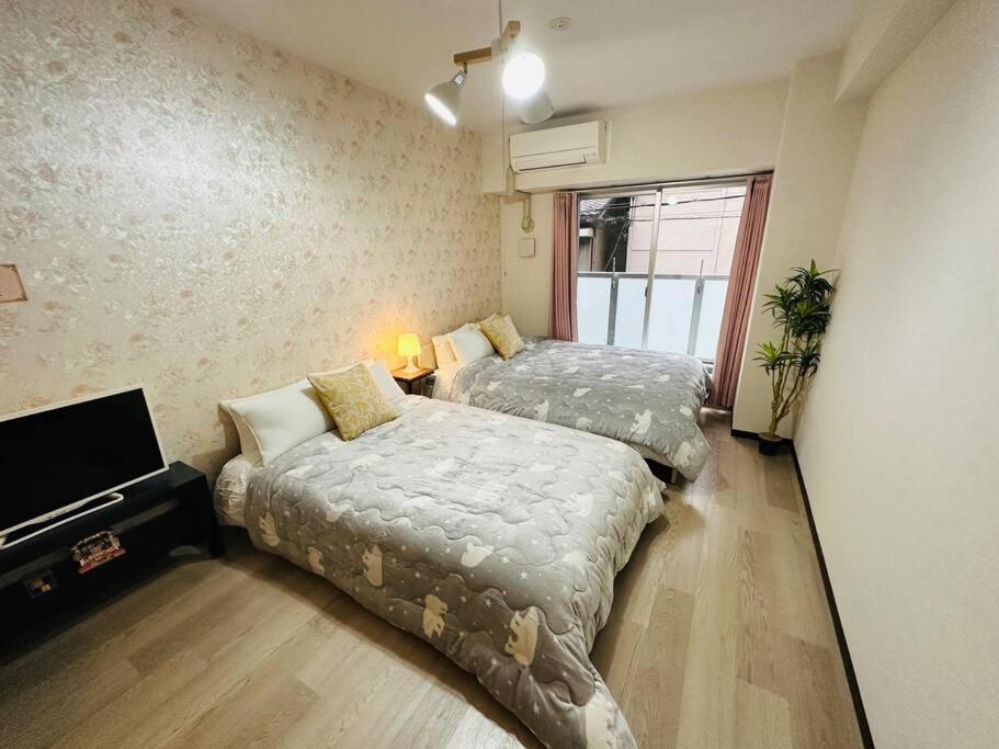 202 黒門市場1分!道頓堀まで徒歩8分!心斎橋まで徒歩9分! Apartment Osaka