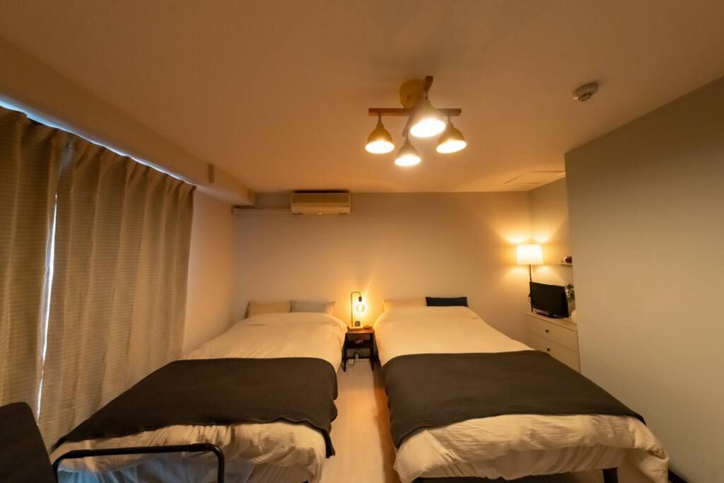 難波駅、道頓堀のそばでシンプルステイ　ベッド3台のお部屋 Apartamento