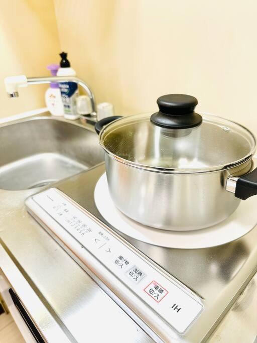 305号室花園町と萩之茶屋駅各2分和室ミニキッチンと専用バスルーム付きアクセス抜群 Apartment