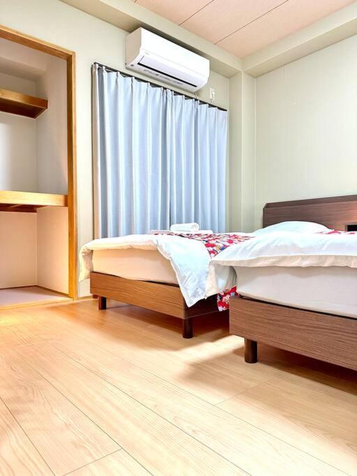 103号室花園町駅と萩之茶屋駅各2分ベット2台専用バスルーム付きアクセス抜群 Apartment *