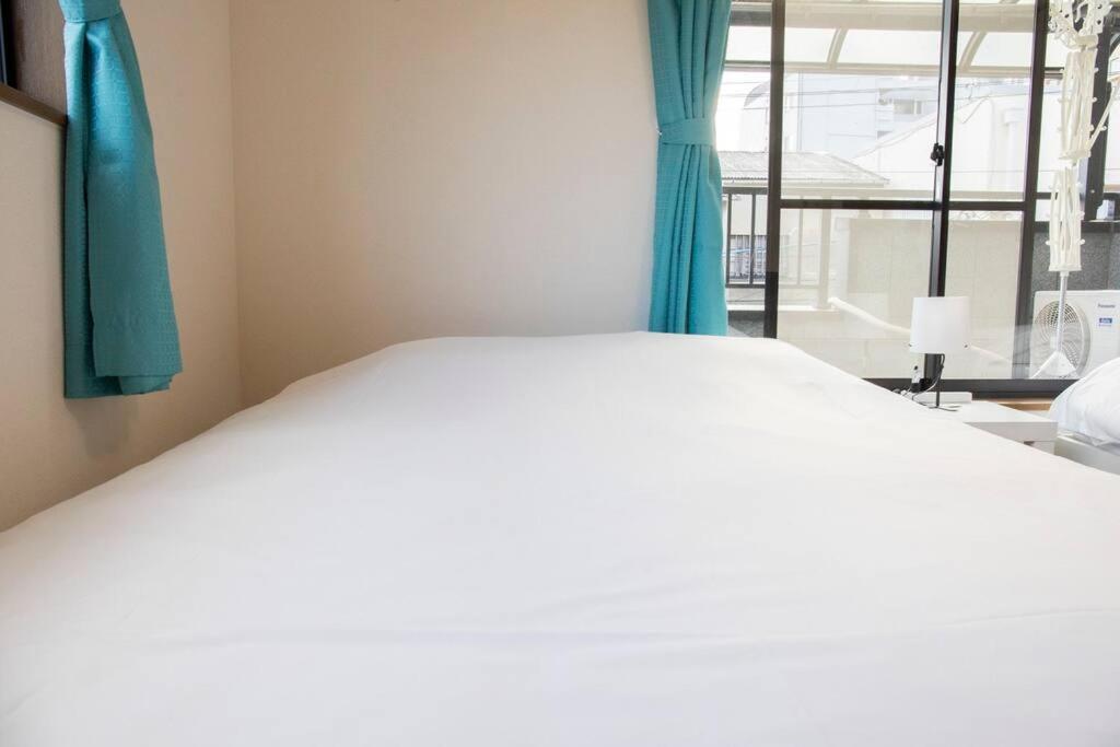 Apartment ゲストハウスわん花園北 Osaka