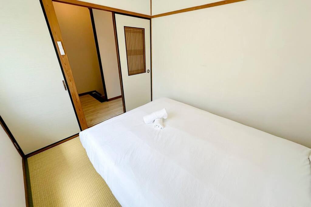 ゲストハウスわん弁天町 Apartamento Osaka