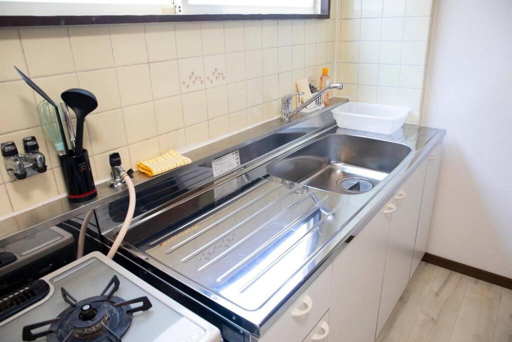 ゲストハウスわん弁天町 Apartamento *