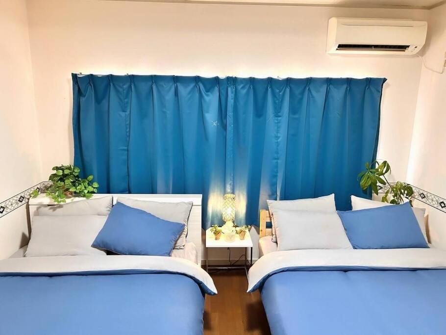 Apartment 団,最大16名,レンタルサイクル無料,usjまで好アクセスの3階建て Osaka