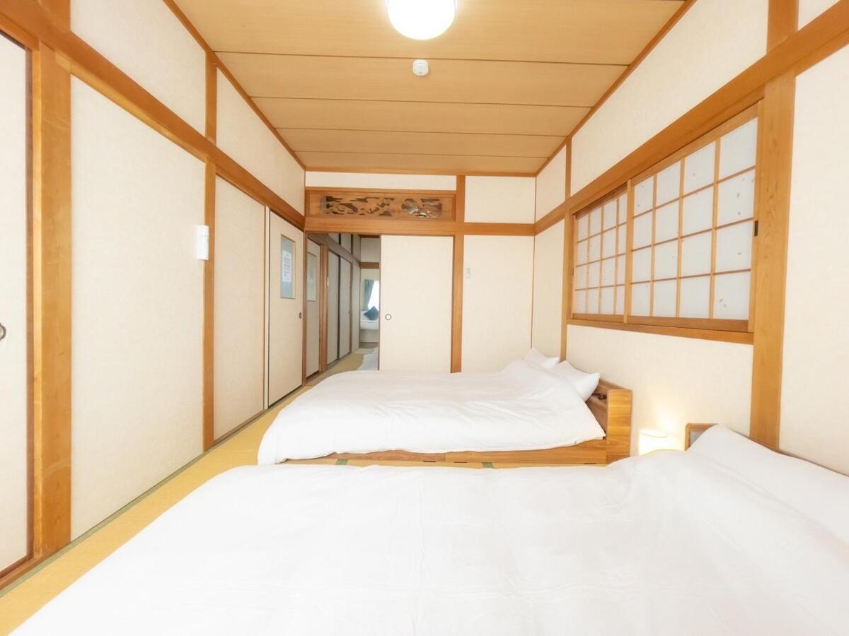 団,最大16名,レンタルサイクル無料,usjまで好アクセスの3階建て Apartment