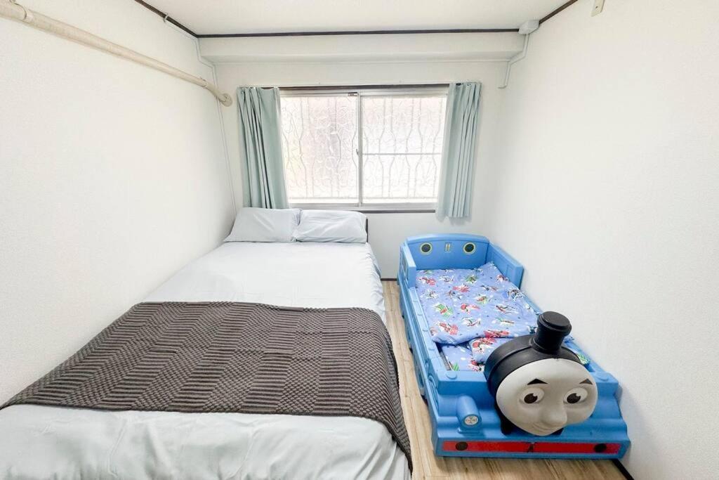 Villa 大正 Guest House! Usjと心斎橋へアクセス抜群!京セラドーム近くの大正駅徒歩5分!12人宿泊可能!一軒家貸切!