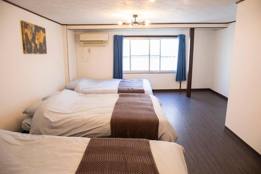 Villa 大正 Guest House! Usjと心斎橋へアクセス抜群!京セラドーム近くの大正駅徒歩5分!12人宿泊可能!一軒家貸切! *